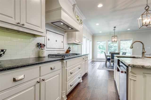 137 White Dove Trl, Denison, TX 75020 - kitchen featuring appliances with stainless steel finishes, custom range hood, a chandelier, white cabinets, and dark wood-type flooring