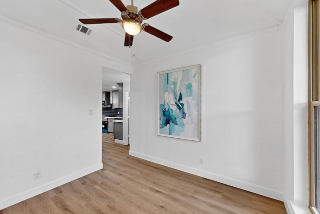 2258 Valley, Carrollton, TX 75006 - empty room with light wood-type flooring, ceiling fan, and crown molding