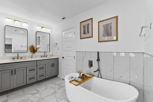2258 Valley, Carrollton, TX 75006 - full bath with double vanity, marble finish floors, and a soaking tub