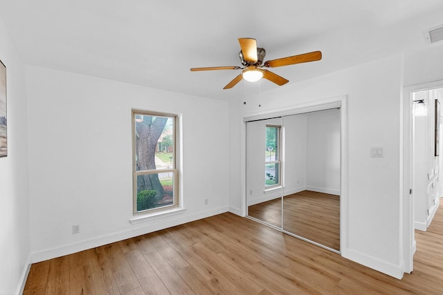 2258 Valley, Carrollton, TX 75006 - unfurnished bedroom featuring light wood-style floors, a closet, and a ceiling fan