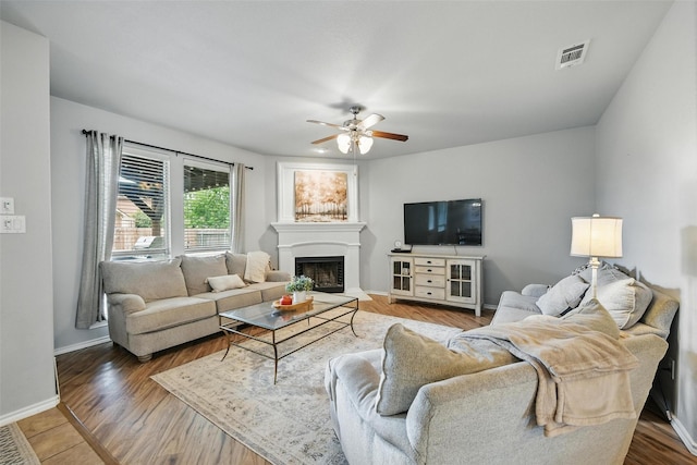 14049 Wrangler Way, Haslet, TX 76052 - living room with ceiling fan, a fireplace, and wood finished floors