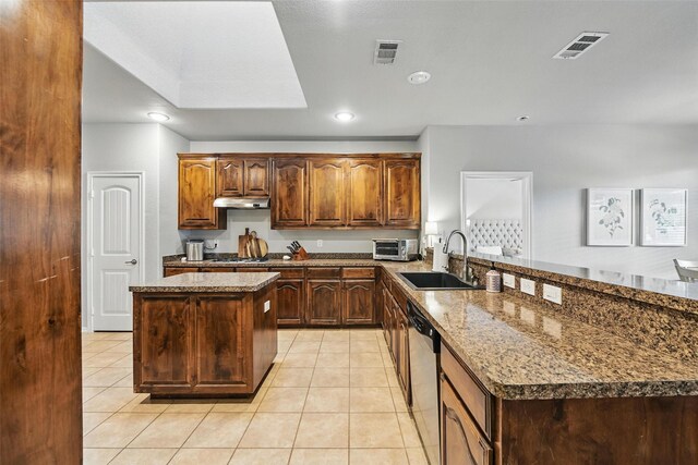 14049 Wrangler Way, Haslet, TX 76052 - kitchen featuring under cabinet range hood, a peninsula, light tile patterned floors, a kitchen island, and dishwasher