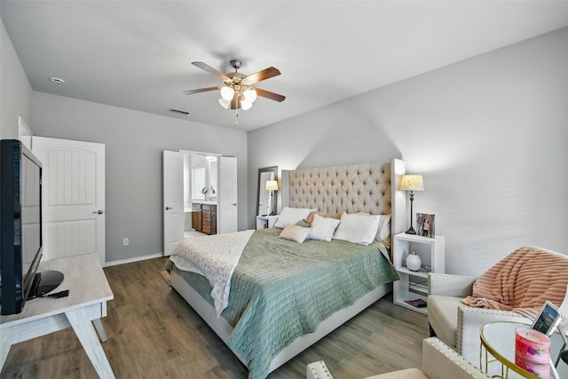 14049 Wrangler Way, Haslet, TX 76052 - bedroom with wood finished floors, a ceiling fan, and connected bathroom