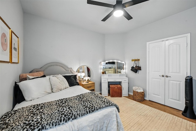 14049 Wrangler Way, Haslet, TX 76052 - bedroom with wood finished floors, a closet, and a ceiling fan