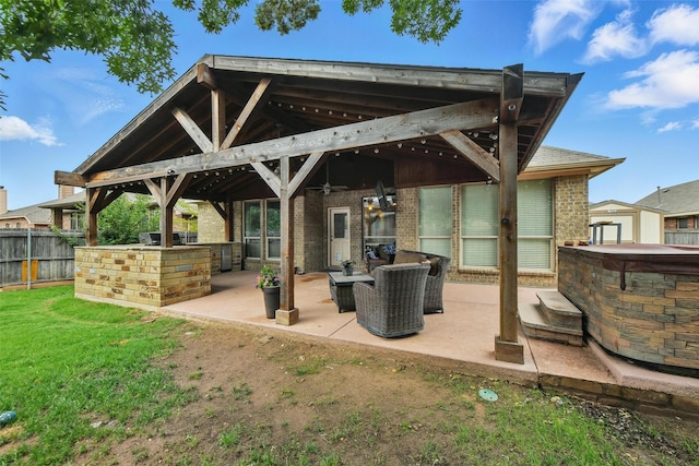 14049 Wrangler Way, Haslet, TX 76052 - back of house featuring a patio area, brick siding, a ceiling fan, and a gazebo