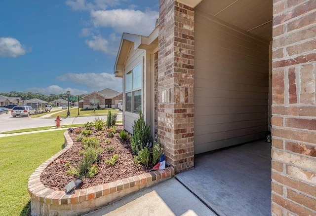 421 Atmore St, Azle, TX 76020 - view of home's exterior with brick siding, a lawn, and a residential view