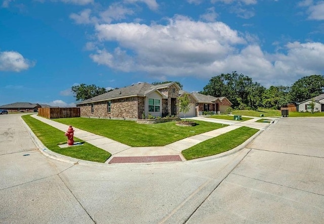 421 Atmore St, Azle, TX 76020 - ranch-style home featuring driveway, a garage, and stone siding
