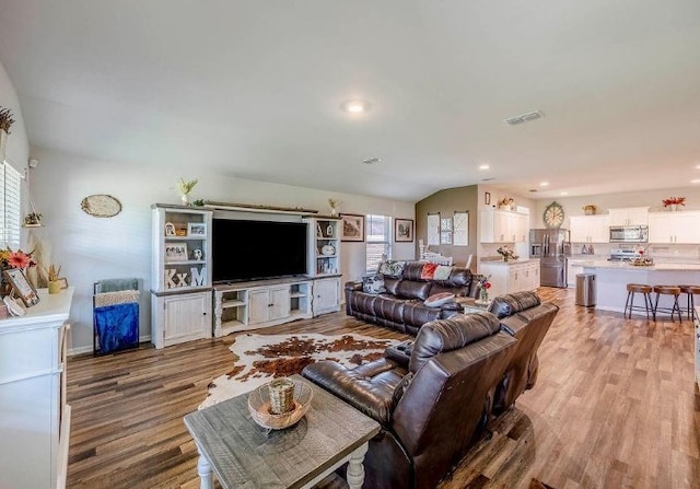 421 Atmore St, Azle, TX 76020 - living area featuring light wood-type flooring, recessed lighting, and vaulted ceiling