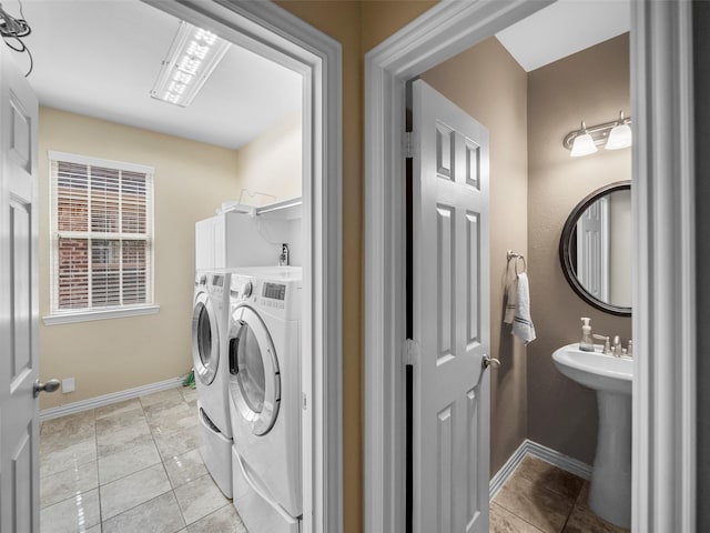 7804 Rocky Mountain Ln, Mckinney, TX 75070 - washroom with washing machine and clothes dryer and light tile patterned floors