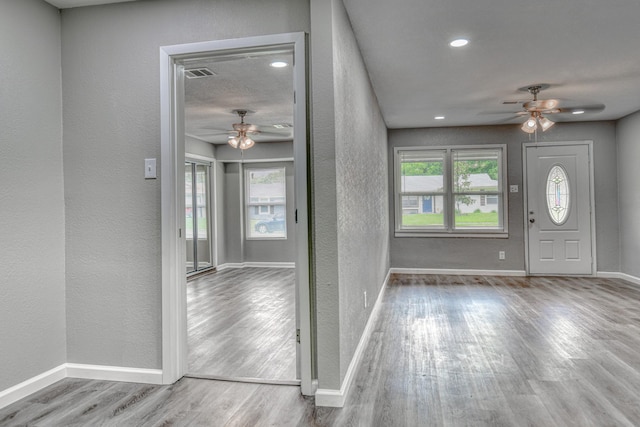 1112 Leyenda Dr, Mesquite, TX 75149 - foyer entrance with ceiling fan, wood finished floors, a textured wall, and recessed lighting