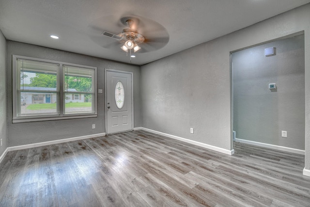 1112 Leyenda Dr, Mesquite, TX 75149 - entrance foyer featuring a ceiling fan, wood finished floors, and a textured wall