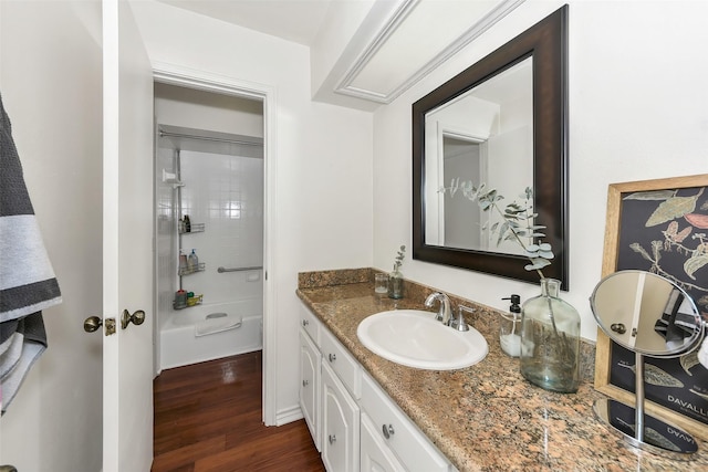 2425 Northgate Dr W, Irving, TX 75062 - full bathroom featuring vanity and wood finished floors