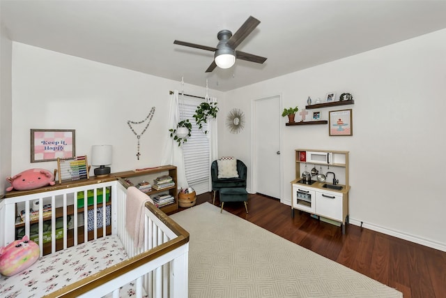 2425 Northgate Dr W, Irving, TX 75062 - bedroom with dark wood-type flooring and ceiling fan