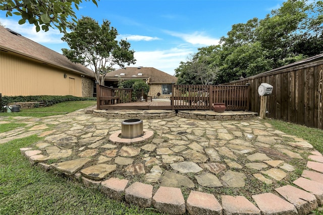 2425 Northgate Dr W, Irving, TX 75062 - view of patio / terrace with an outdoor fire pit and a wooden deck