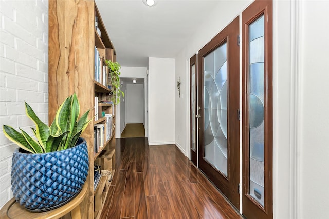 2425 Northgate Dr W, Irving, TX 75062 - hallway featuring dark wood-style floors and baseboards