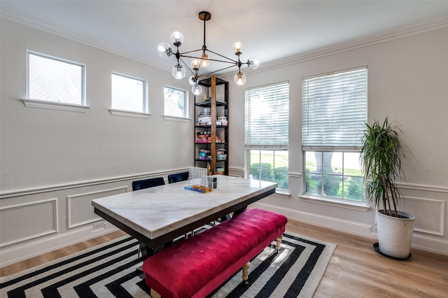 1404 Settlers Ct, Allen, TX 75002 - dining space featuring ornamental molding, a chandelier, light wood-style floors, a wainscoted wall, and a decorative wall