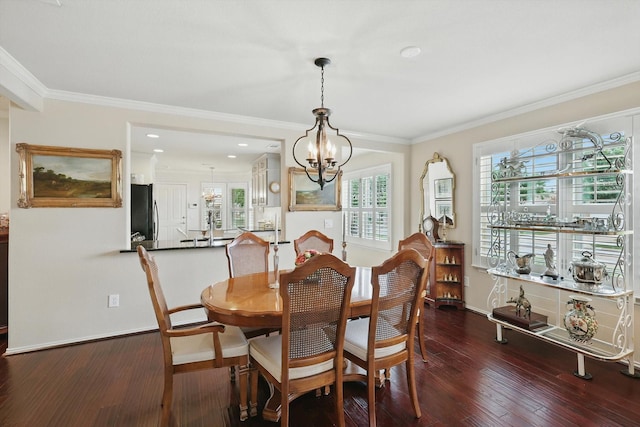 7972 Tatum Dr, Frisco, TX 75036 - dining space with a chandelier, dark wood-style flooring, and crown molding