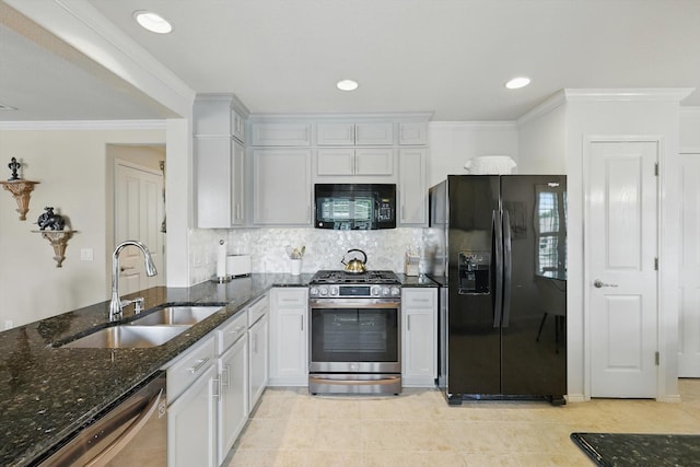 7972 Tatum Dr, Frisco, TX 75036 - kitchen featuring black appliances, dark stone counters, decorative backsplash, ornamental molding, and light tile patterned flooring