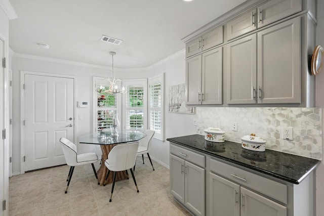 7972 Tatum Dr, Frisco, TX 75036 - dining space featuring a chandelier, ornamental molding, and light tile patterned floors