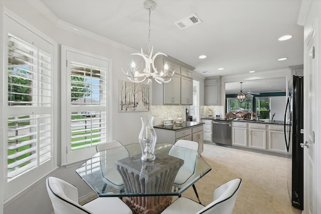 7972 Tatum Dr, Frisco, TX 75036 - dining area featuring a chandelier, recessed lighting, and ornamental molding