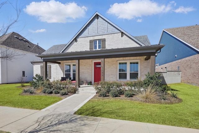 1208 S Pecan Pkwy, Northlake, TX 76247 - view of front of house featuring a porch, brick siding, and a front lawn