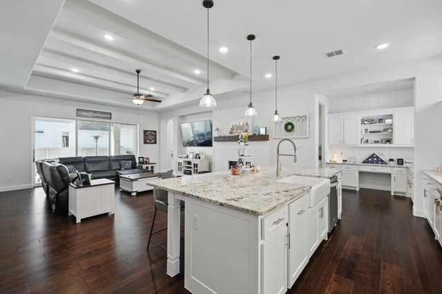 1208 S Pecan Pkwy, Northlake, TX 76247 - kitchen with open shelves, dark wood-type flooring, white cabinets, arched walkways, and recessed lighting