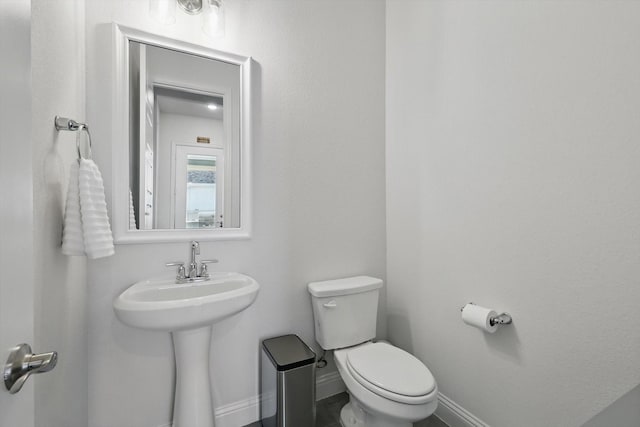 1208 S Pecan Pkwy, Northlake, TX 76247 - half bathroom with baseboards and toilet