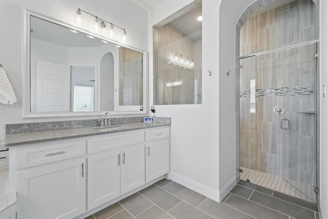 1208 S Pecan Pkwy, Northlake, TX 76247 - bathroom featuring tile patterned flooring, a shower stall, and vanity