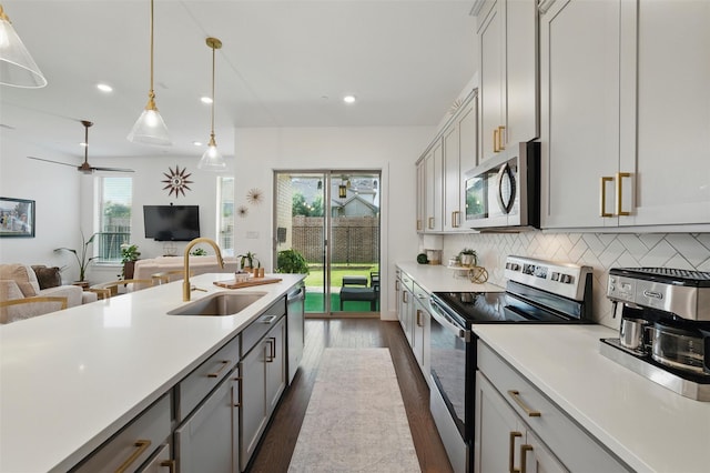 1078 Maverick Dr, Allen, TX 75013 - kitchen with appliances with stainless steel finishes, gray cabinets, light countertops, dark wood-type flooring, and recessed lighting