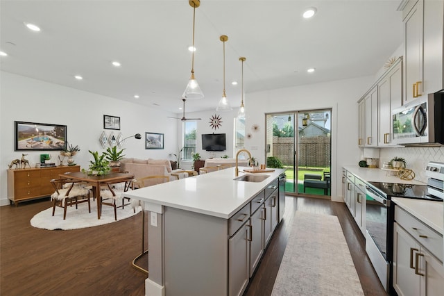 1078 Maverick Dr, Allen, TX 75013 - kitchen featuring appliances with stainless steel finishes, dark wood-style flooring, gray cabinetry, recessed lighting, and light countertops