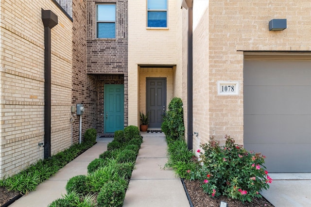 1078 Maverick Dr, Allen, TX 75013 - view of exterior entry featuring a garage and brick siding