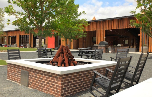 1736 Bonsmara Dr, Northlake, TX 76247 - view of patio / terrace with an outdoor kitchen and a fire pit