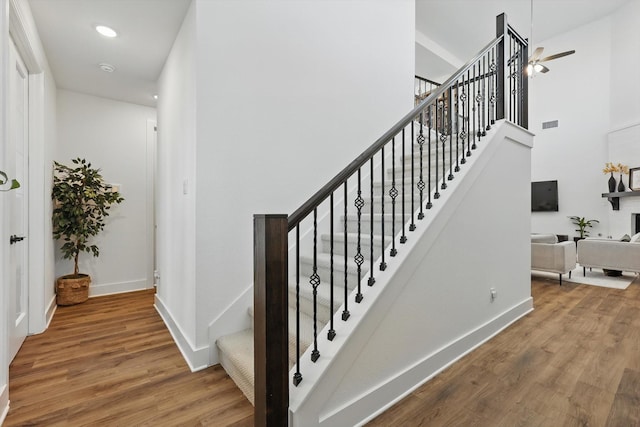 1736 Bonsmara Dr, Northlake, TX 76247 - staircase with wood finished floors, a high ceiling, and recessed lighting