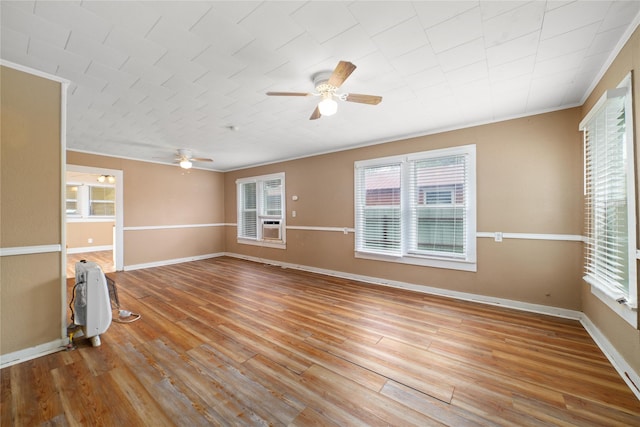 701 S Austin St, De Leon, TX 76444 - unfurnished room with a ceiling fan, ornamental molding, and wood finished floors