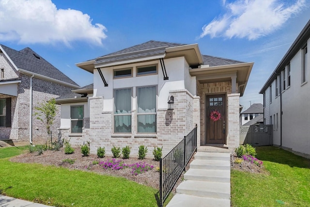 1705 Horizon Way, Northlake, TX 76247 - view of front of house featuring stucco siding, a front lawn, roof with shingles, and brick siding