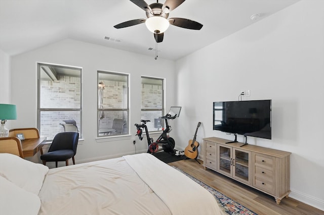 1705 Horizon Way, Northlake, TX 76247 - bedroom featuring wood finished floors, vaulted ceiling, and a ceiling fan
