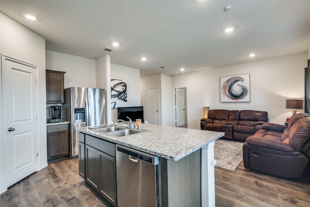 706 Meadow Creek Ln, Josephine, TX 75189 - kitchen with appliances with stainless steel finishes, open floor plan, dark wood-style floors, recessed lighting, and a kitchen island with sink