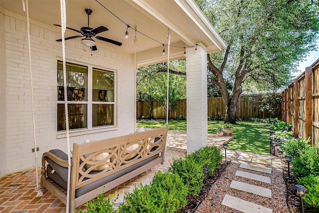 6013 El Campo Ave, Fort Worth, TX 76107 - fenced backyard featuring ceiling fan and a patio