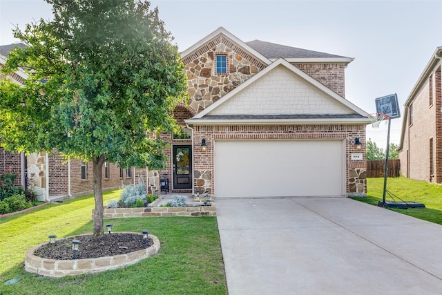 604 Grand Falls Ln, Mckinney, TX 75071 - view of front of house featuring driveway, stone siding, brick siding, and an attached garage