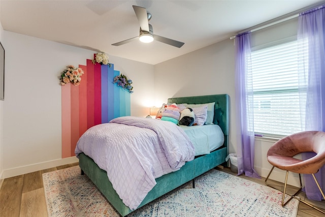 604 Grand Falls Ln, Mckinney, TX 75071 - bedroom featuring wood finished floors and ceiling fan