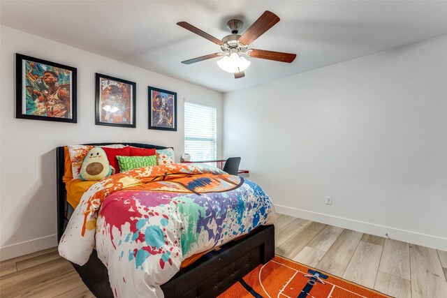 604 Grand Falls Ln, Mckinney, TX 75071 - bedroom with wood finished floors and ceiling fan