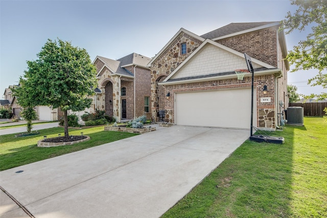 604 Grand Falls Ln, Mckinney, TX 75071 - view of front of property featuring an attached garage, concrete driveway, brick siding, a shingled roof, and stone siding