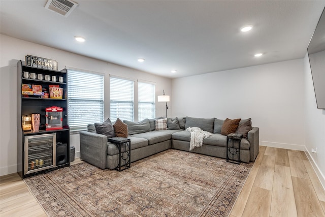 604 Grand Falls Ln, Mckinney, TX 75071 - living room with light wood-style flooring, a dry bar, and recessed lighting