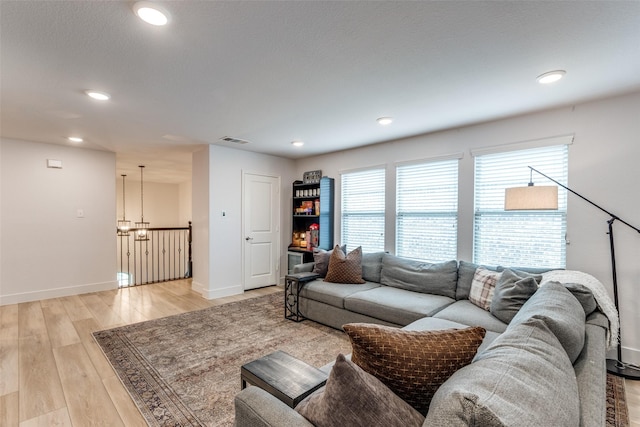 604 Grand Falls Ln, Mckinney, TX 75071 - living area with a chandelier, light wood-type flooring, and recessed lighting
