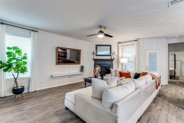 604 Grand Falls Ln, Mckinney, TX 75071 - living room with wood finished floors, healthy amount of natural light, and a ceiling fan