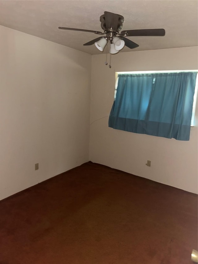 1815 Redwood St, Arlington, TX 76014 - unfurnished room with ceiling fan and dark colored carpet