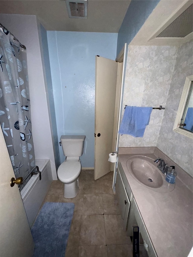 1815 Redwood St, Arlington, TX 76014 - full bathroom with vanity, shower / bath combo with shower curtain, and tile patterned floors