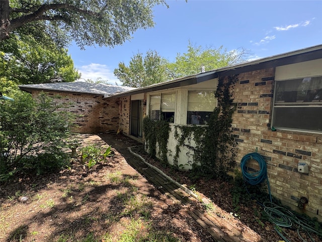 1815 Redwood St, Arlington, TX 76014 - view of side of property with brick siding