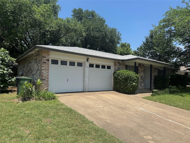 1815 Redwood St, Arlington, TX 76014 - ranch-style house with brick siding, driveway, a garage, and a front lawn