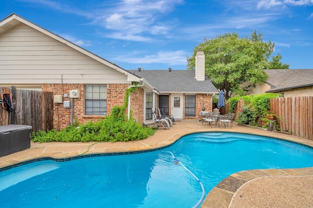 3909 Commonwealth Dr, Flower Mound, TX 75028 - view of swimming pool with a patio area and a fenced backyard